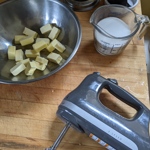 butter chunked up into a mixing bowl