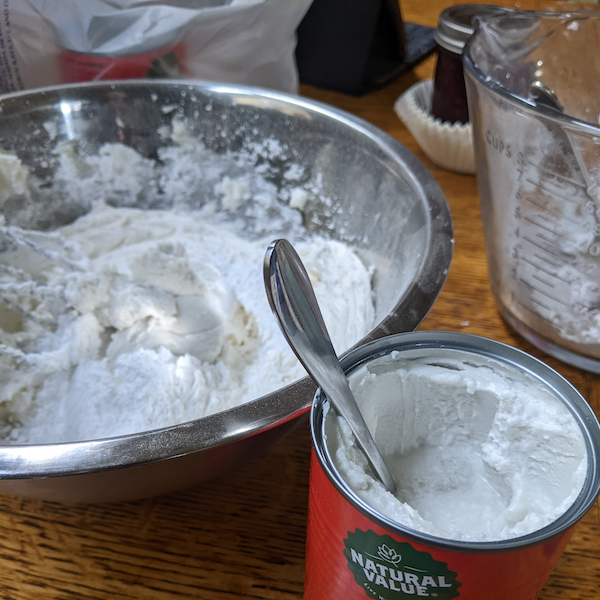 add coconut milk cream to frosting mixture